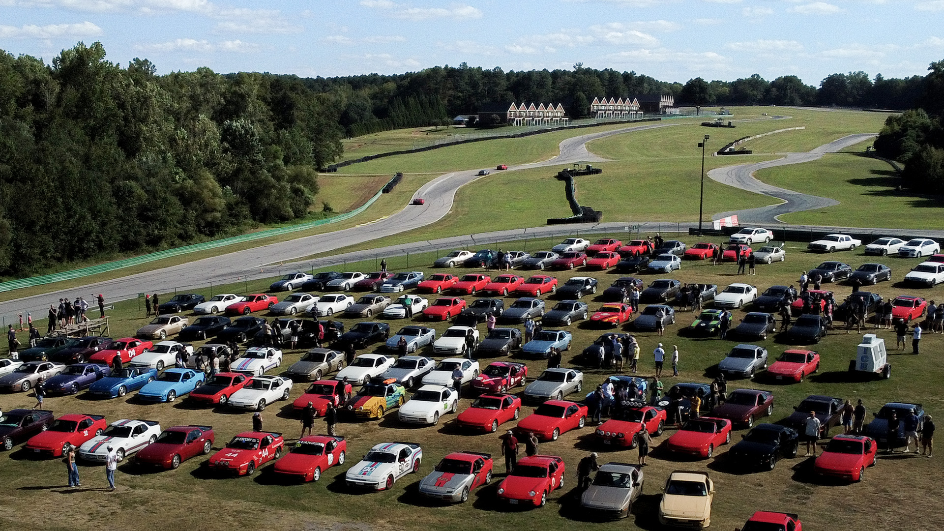 The car show field at 944Fest, rows of Porsche 944s
